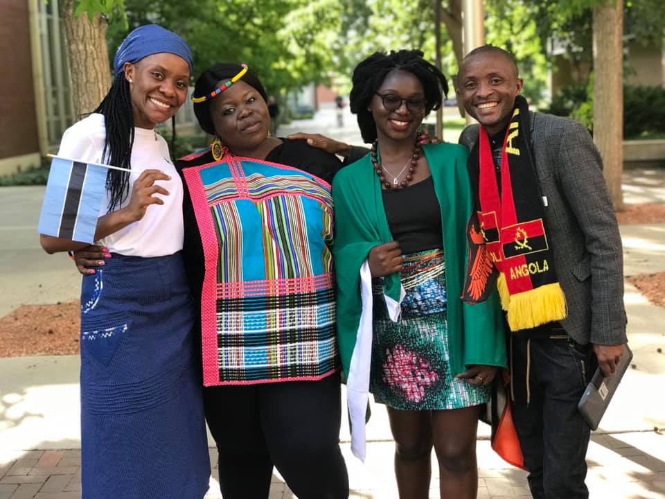 2019 Fellows pose for a photo at Boise State University wearing colorful traditional tress.