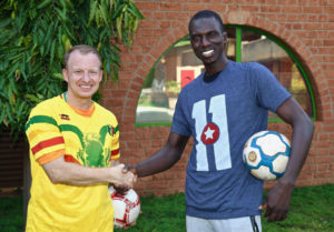 2019 Reciprocal Exchange Awardee Bryan Richards exchanges soccer jerseys with 2018 Fellow Boubacar Sy during their workshop’s closing ceremony in Bamako, Mali.