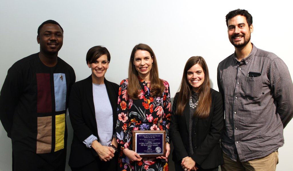 Sarah Boeving receives the International Innovative Educator of the Year Award, on behalf of the U.S. Department of State, and poses with the Fellowship team at Kansas State University.