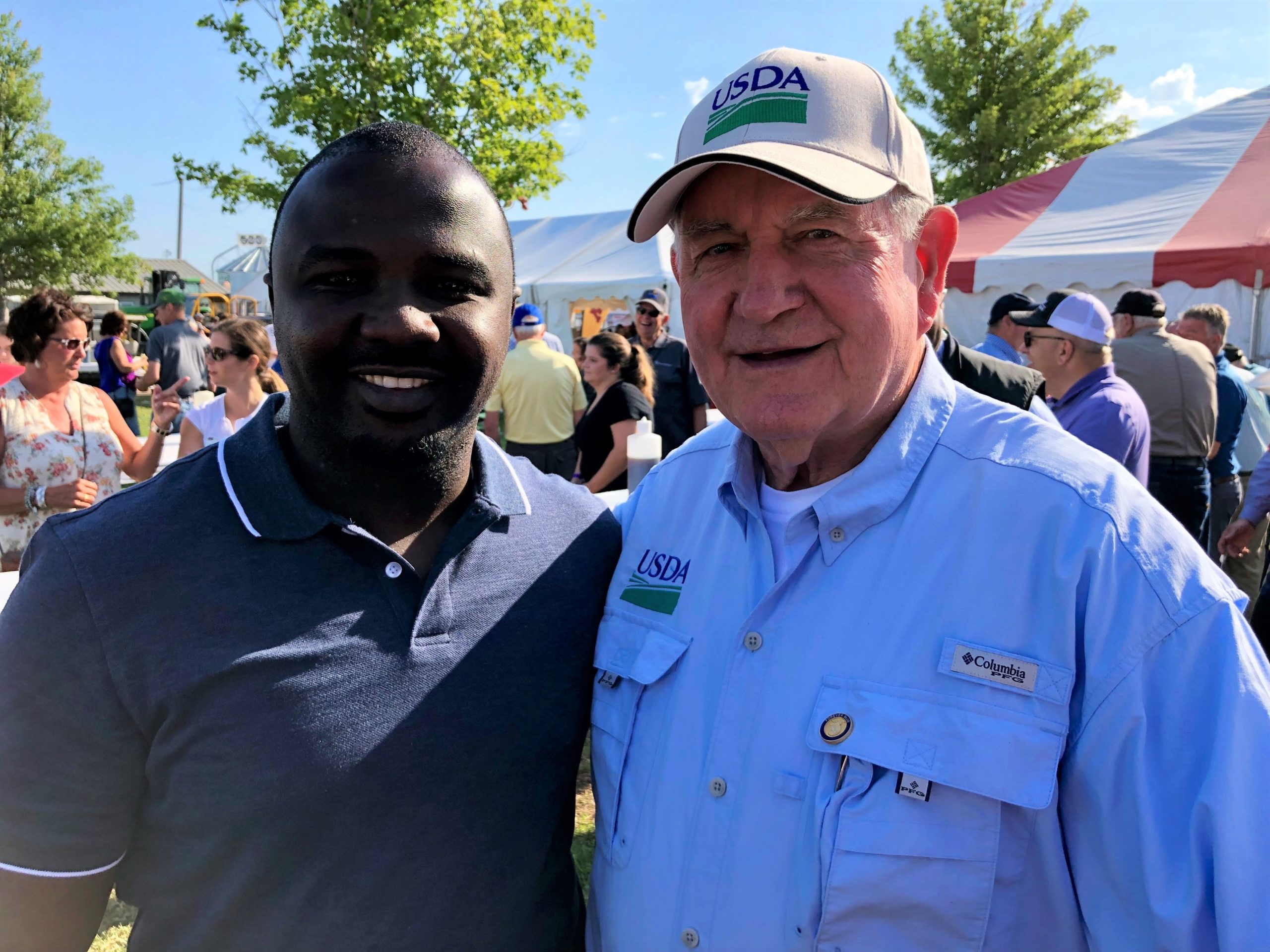 2019 Fellow Laurent Shilingi had the opportunity to meet Secretary of Agriculture Sonny Perdue at FarmFest in rural Minnesota.