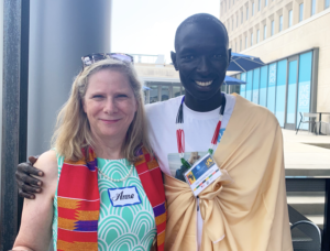 A woman and man smile for the camera