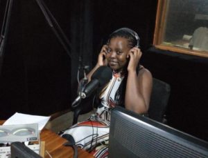 A young woman speaks on a radio broadcast