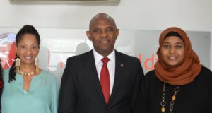 Sheila Hawkins-Bucklew and Hauwa pose for a photo with entrepreneur and philanthropist Tony Elumelu in Lagos.
