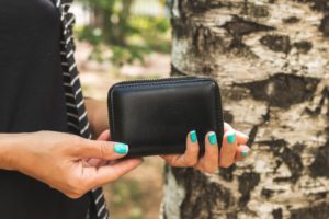 Close-up shot of a woman holding a wallet