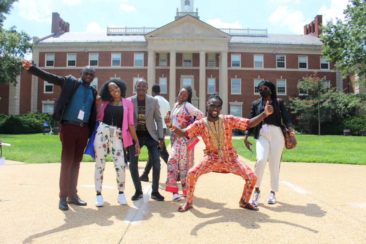 Group of Fellows in front of a building on the Howard University campus